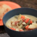 Blue ceramic bowl of simple creamy vomaka soup